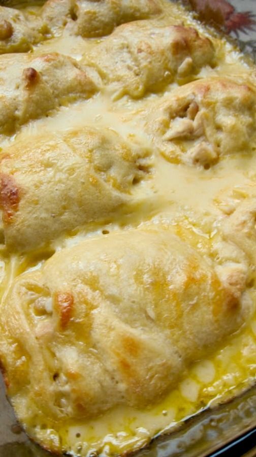 Chicken Roll Ups ~ chicken breasts wrapped in crescent rolls and smothered with cream of chicken soup, milk and cheese