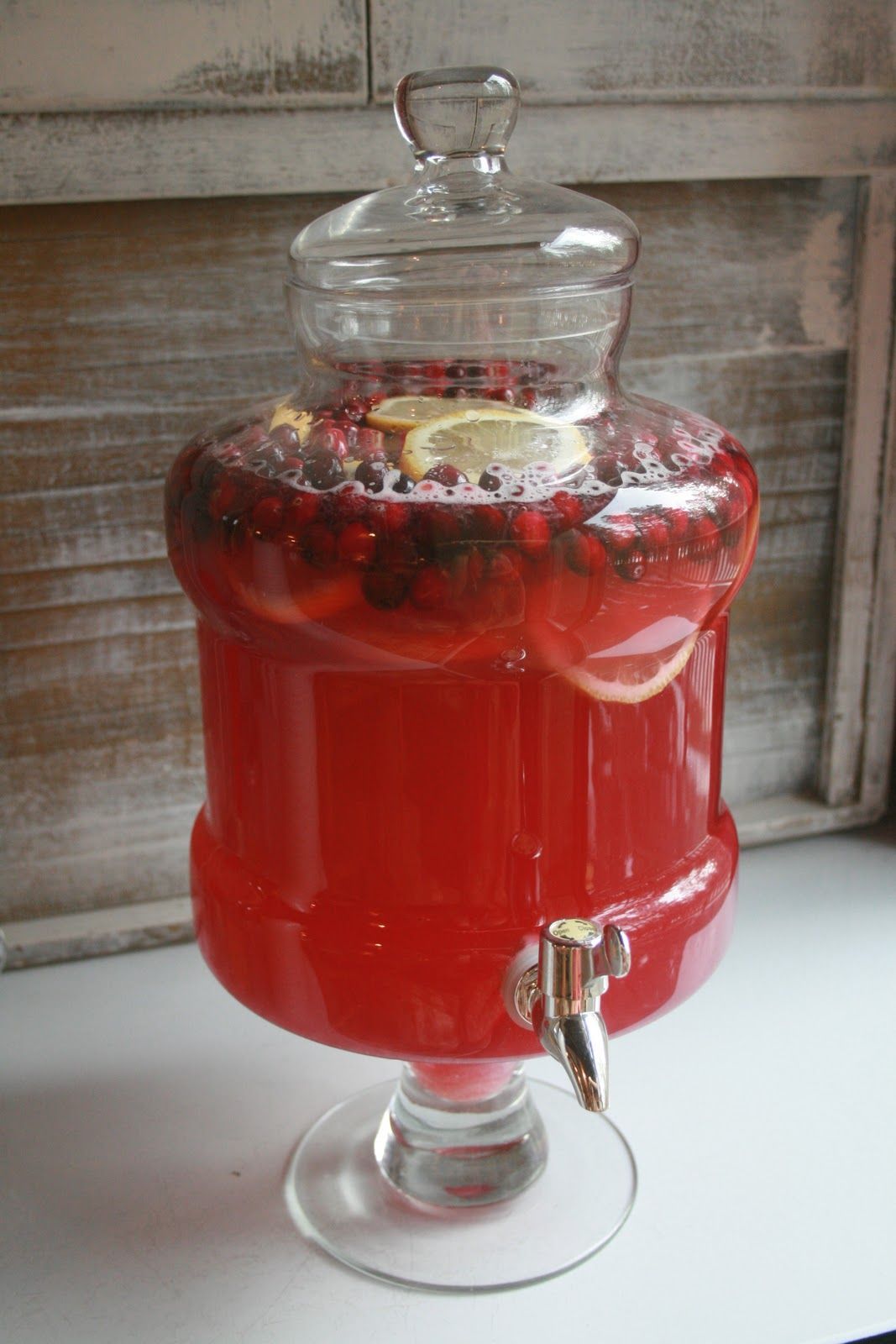 Christmas punch – one part lemonade, one part cranberry juice, one part ginger ale, a bag of cranberries and two sliced lemons.