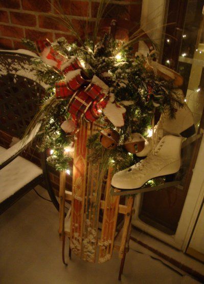 Decorate An Old Sled…with pine and lights & vintage ice skates for the front porch for the holidays. There are other fabulous
