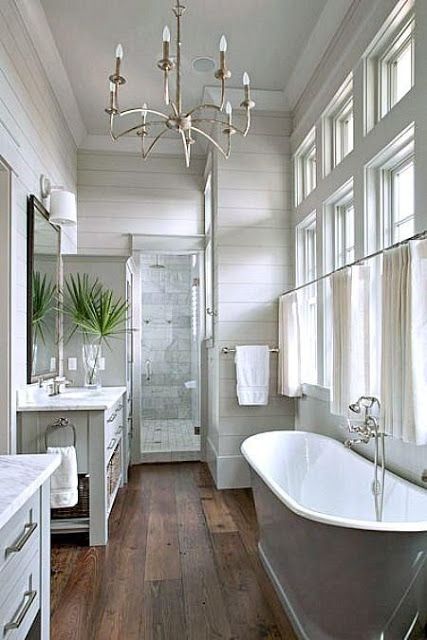 Faux wood tiles, planked walls, marble tile in shower via FRENCH COUNTRY COTTAGE: 5 favorite tile options for bathrooms