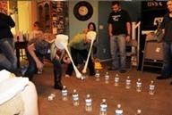 Head Bang Game: What you need: Pantihose, Balls, 16-20 small water bottels.  How to play:  Line two rows of bottels up. Divide the