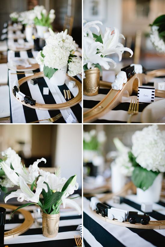 LOVE the whimsical table decor featuring an Ikea train set painted gold with a black and white train set, winding around the