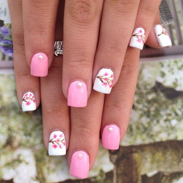 Pink mani with cherry blossom accent nails on white base nail art design