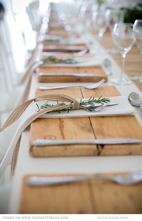 Rustic table setting with wooden slabs, rosemary and burlap ribbon via The Pretty Blog.  Photography by Nikki Meyer.