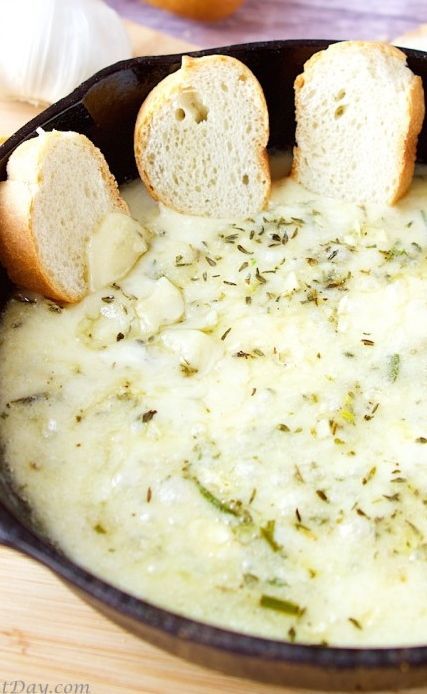 Skillet baked brie and garlic dip that is addicting.