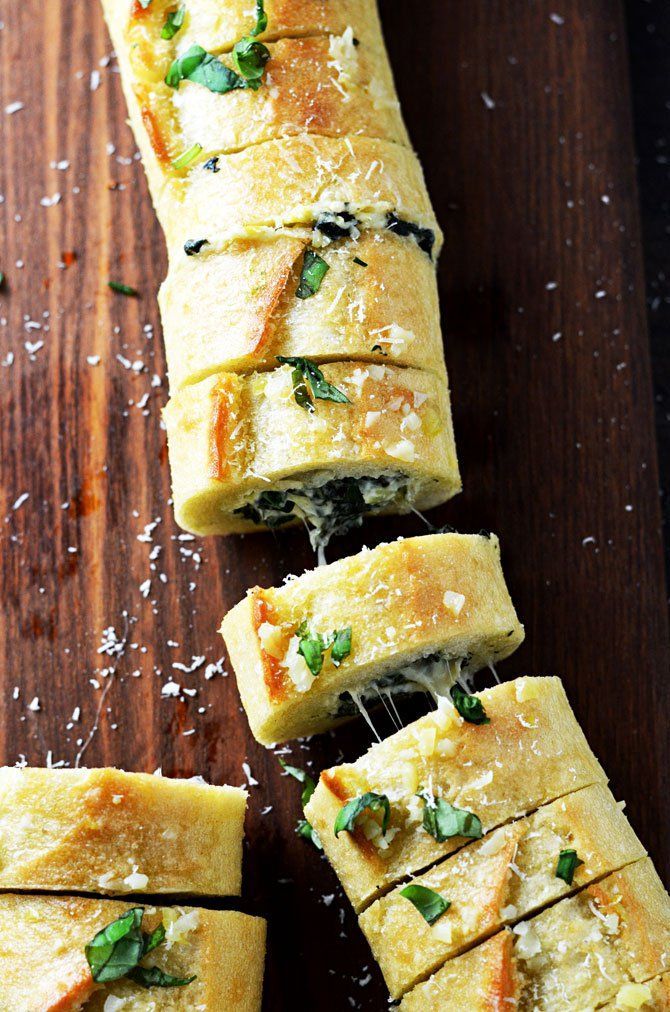 Spinach and Artichoke Dip Stuffed Garlic Bread. This is everything you’ve ever wanted in an appetizer and more. | hostthetoast.com
