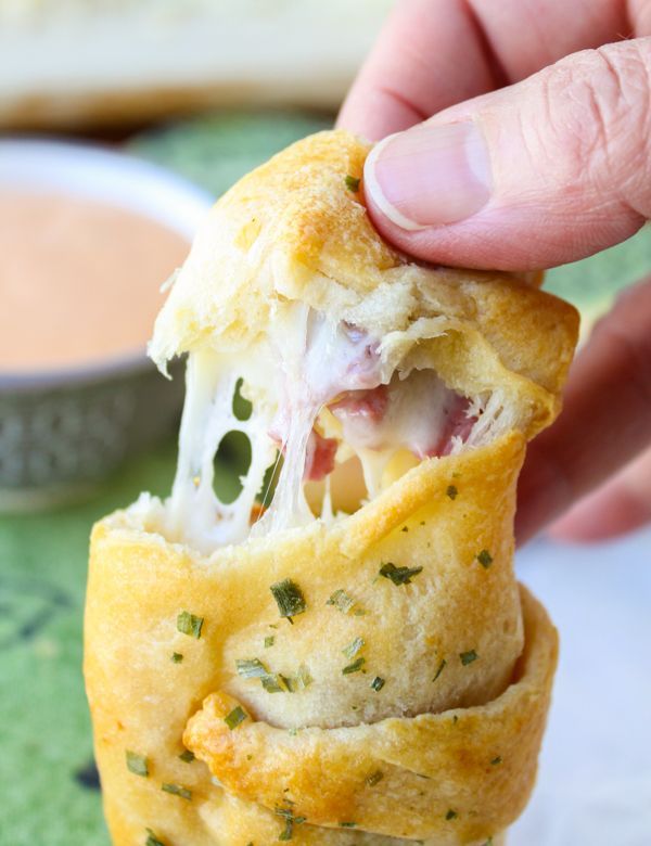 The Food Charlatan // Reuben Sandwich inspired crescent rolls are easy, fast, and the perfect appetizer to support your loafing on