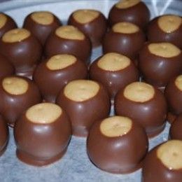 These Buckeye candies are not hard to make at all and can be used for festive Christmas gifts! Buckeyes are peanut butter balls