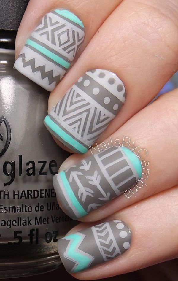 Tribal designs in gray and sea green polish. Complete your winter nail look with these fu looking tribal designs in darker gray
