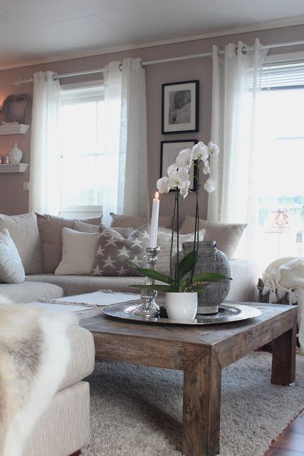 A gorgeous dusty brown and cream combination living room creates the perfect relaxing and warming space. We just adore this room!