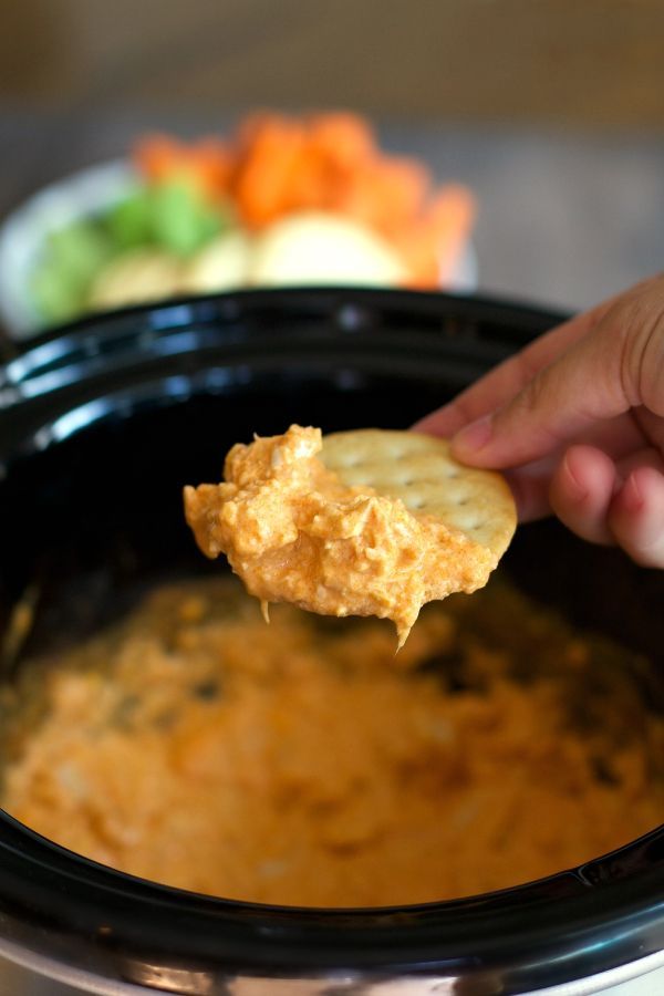 I’ve got a little better way to get all the flavors of the buffalo wings, but in a neater Cheesy Buffalo Chicken Dip.