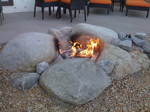 Natural Rock Fire pit…utilize boulders, large stones and sand or fire bricks to create an organic shaped pit.  These types of