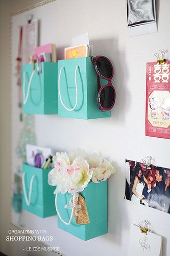 Pin up the prettiest shopping bags on your wall, and turn them into little organizers. Source: Le Zoe Musings