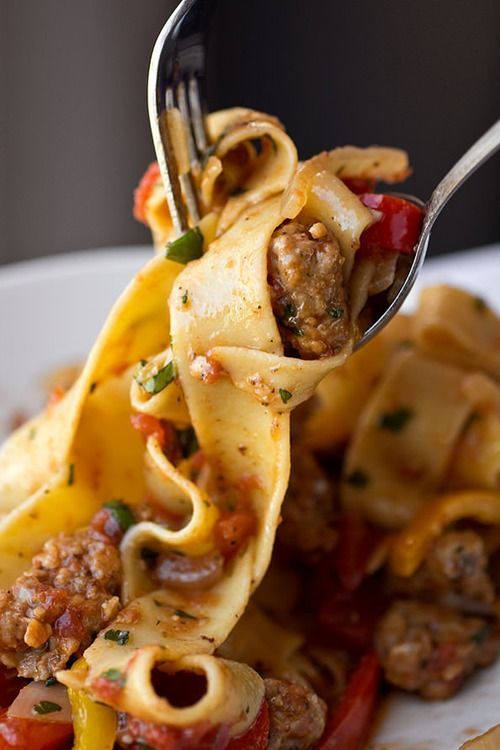 Saucy, Italian “Drunken” Noodles with Spicy Italian Sausage, Tomatoes and Caramelized Onions and Red and Yellow Bell Peppers,
