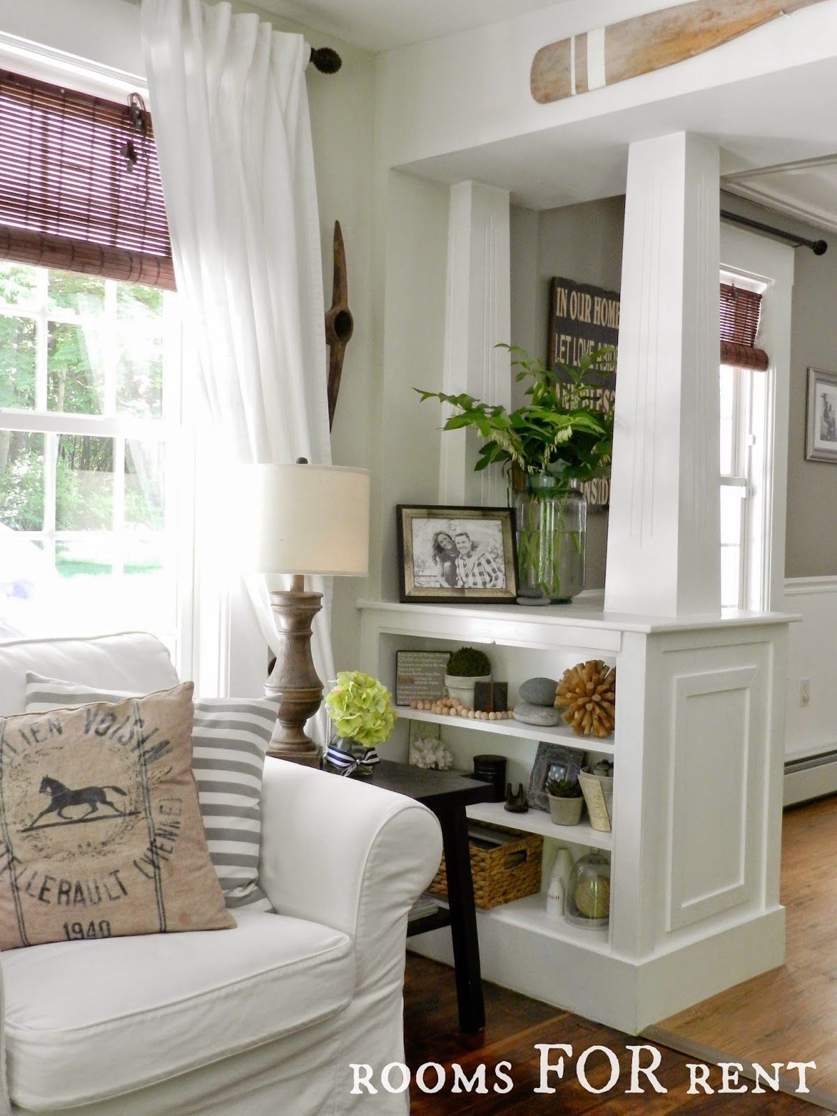 White columns with built in shelves . . . great to divide up a room and give the feel of an entry area. ♥