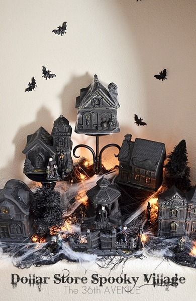 Take dollar store christmas village and paint it for Halloween Village