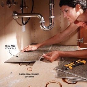 Peel and stick tiles under the sink. Looks clean and is easy to wipe the surface