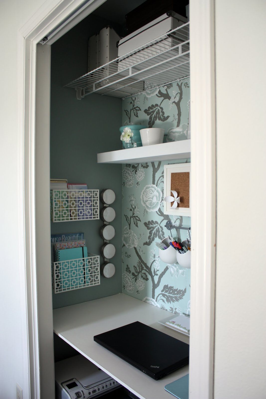 Organize your office with wall shelving and storage boxes.