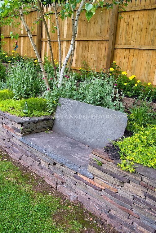 Stone garden bench | Plant & Flower Stock Photography: GardenPhotos.com -   14 garden design Stones planters ideas