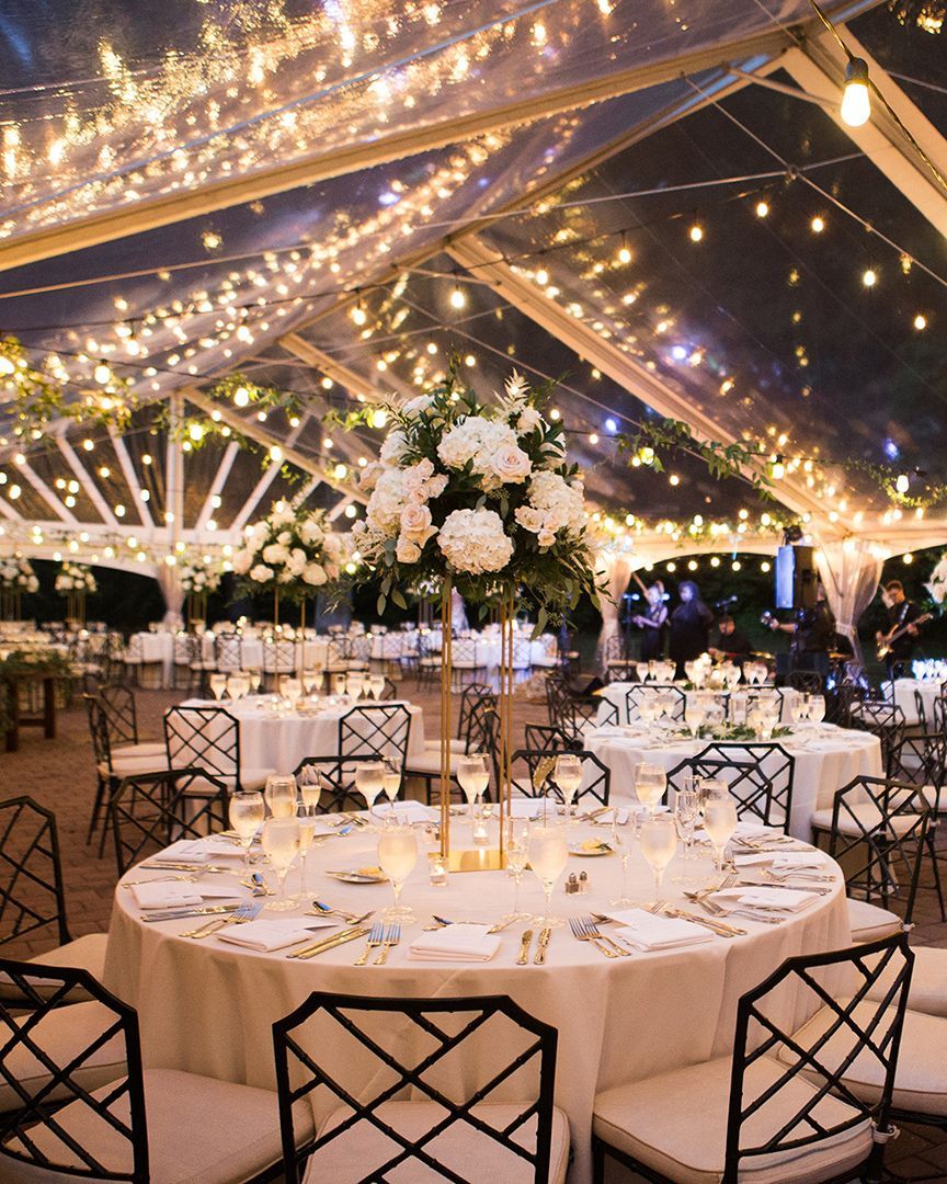 Photo by DOLA Photography {dolaphoto.com} | Clear tent wedding reception with string lights -   18 wedding Beach lights ideas