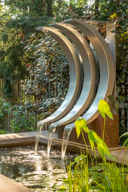 Crescent-Shaped Water Feature -   18 garden design Pergola water features ideas
